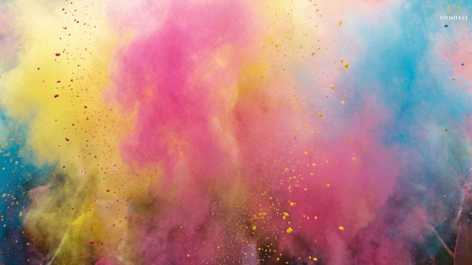 Vibrant Holi colors exploding in the air with pink, yellow, and blue powder creating a festive atmosphere