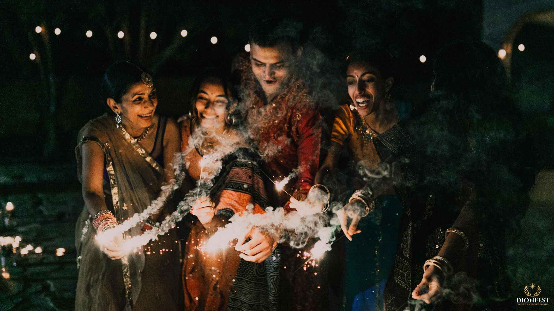 Friends celebrating Diwali with sparklers at night