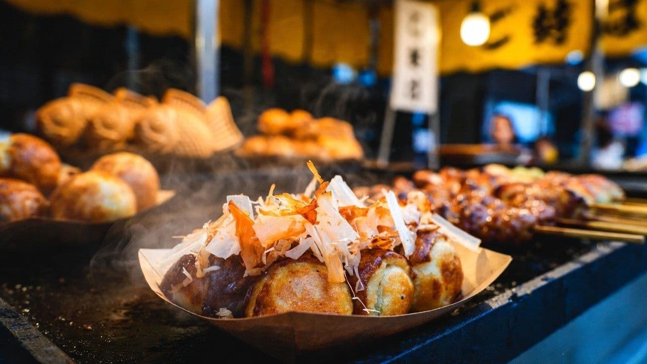 Fresh takoyaki and taiyaki at Gion Matsuri yoiyama food stall Kyoto Japan