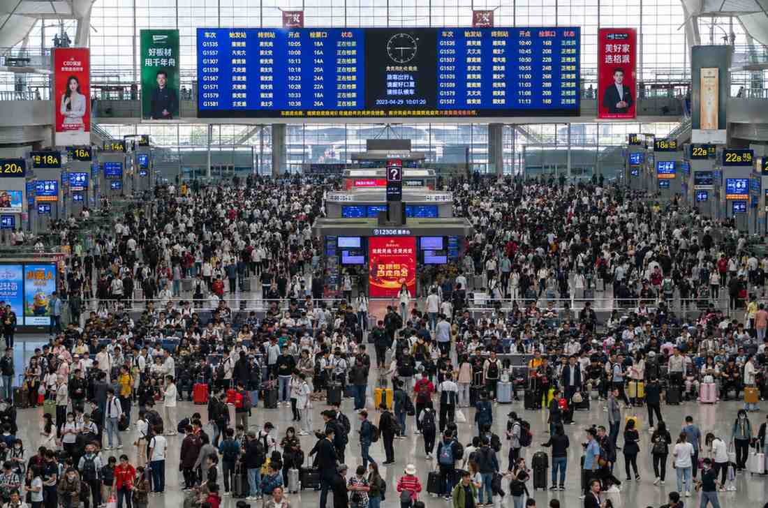 Crowded Chinese high speed train station during Golden Week holiday travel rush 2026
