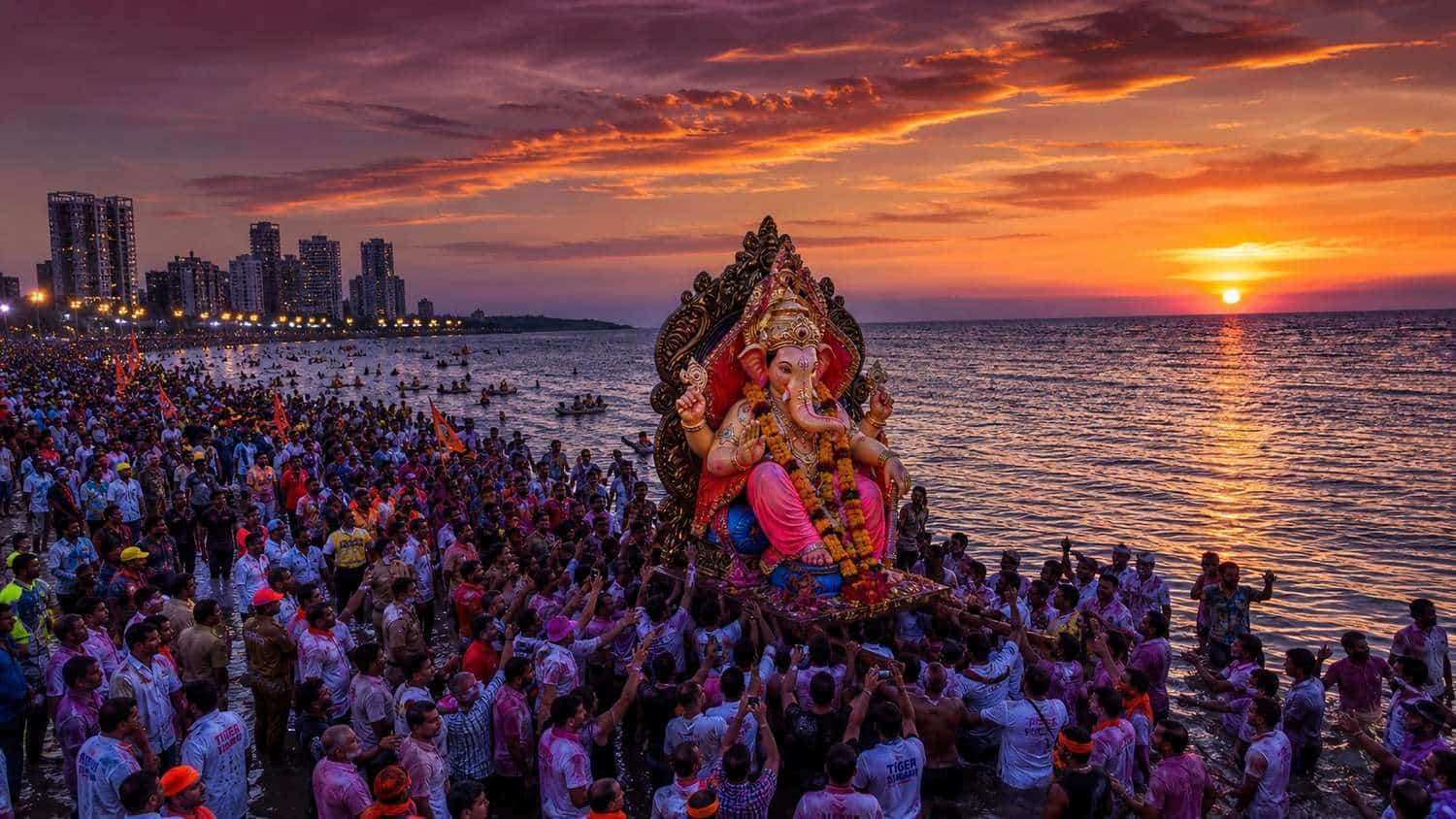 Ganesh Visarjan 2026 procession at Mumbai beach with devotees immersing Ganesha idol at sunset