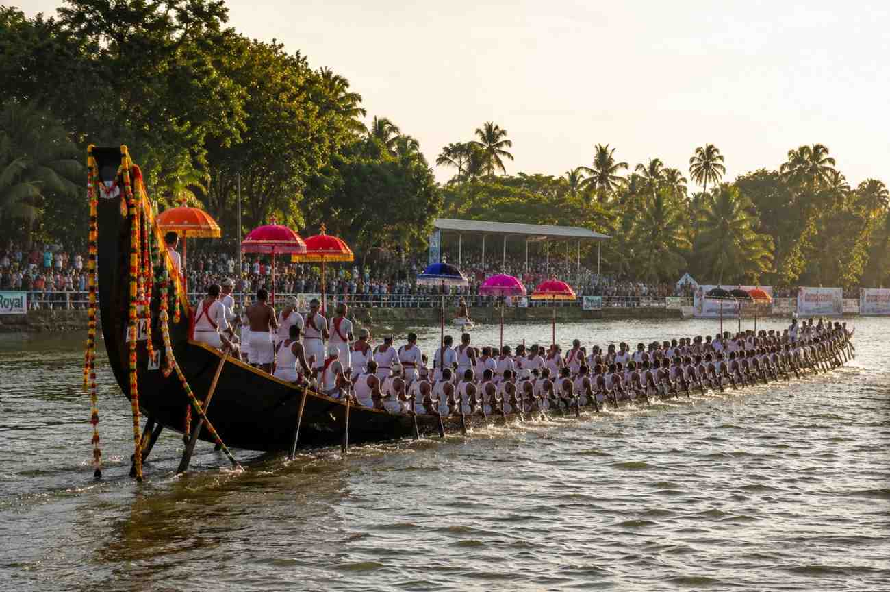 Kerala snake boat race vallamkali during Onam with hundreds of rowers on the backwaters