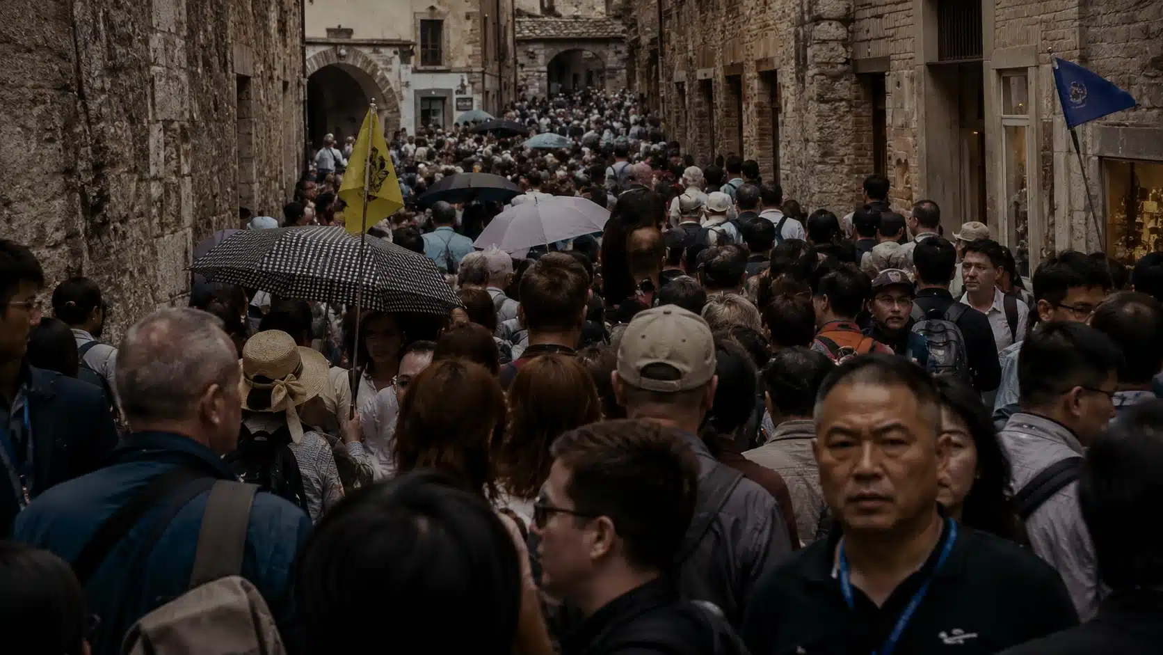 Dense tourist crowd in a historic street illustrating festival overtourism strain