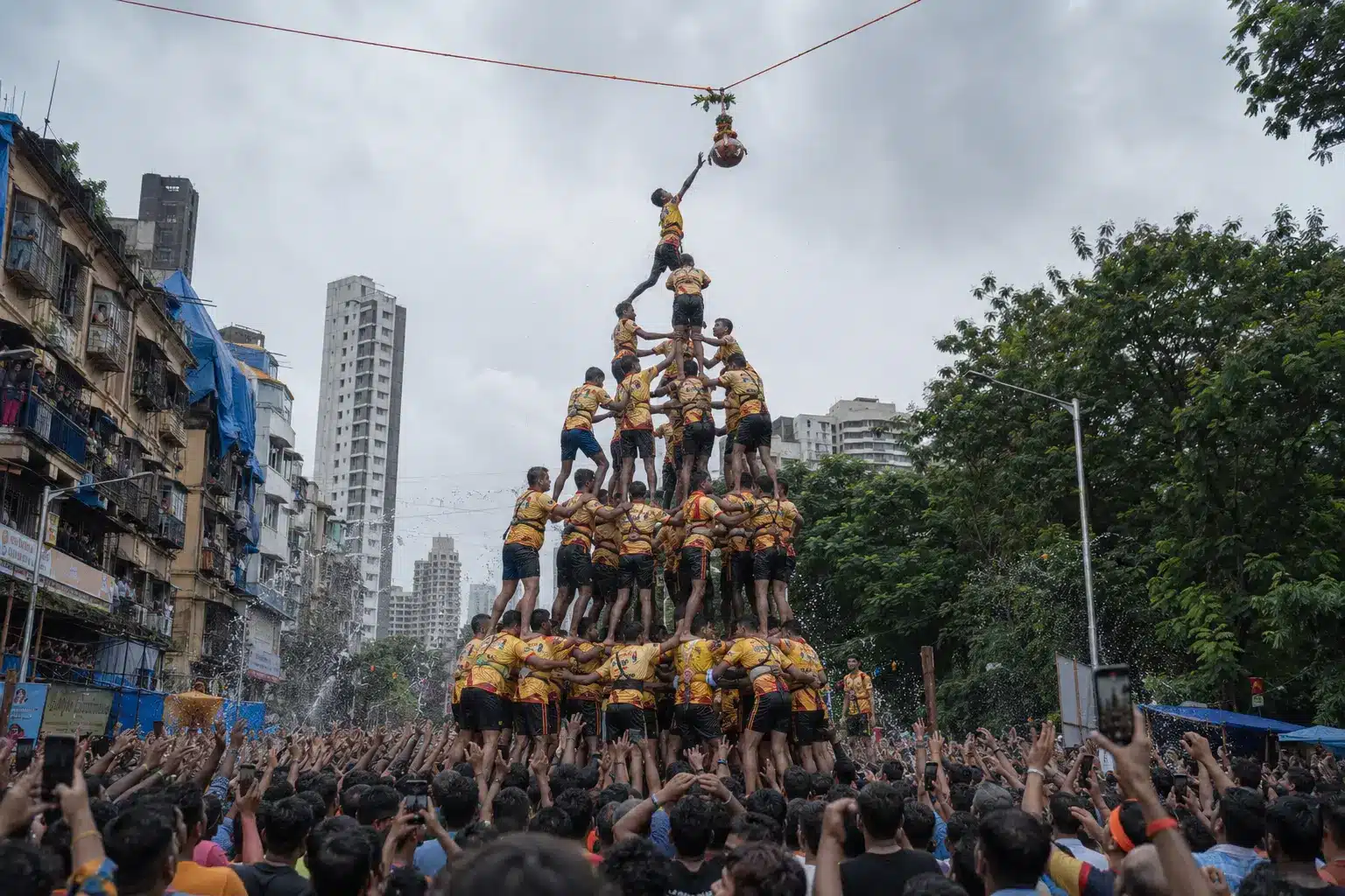 Janmashtami 2026 Dahi Handi in Mumbai — Govindas forming a human pyramid to break the curd pot