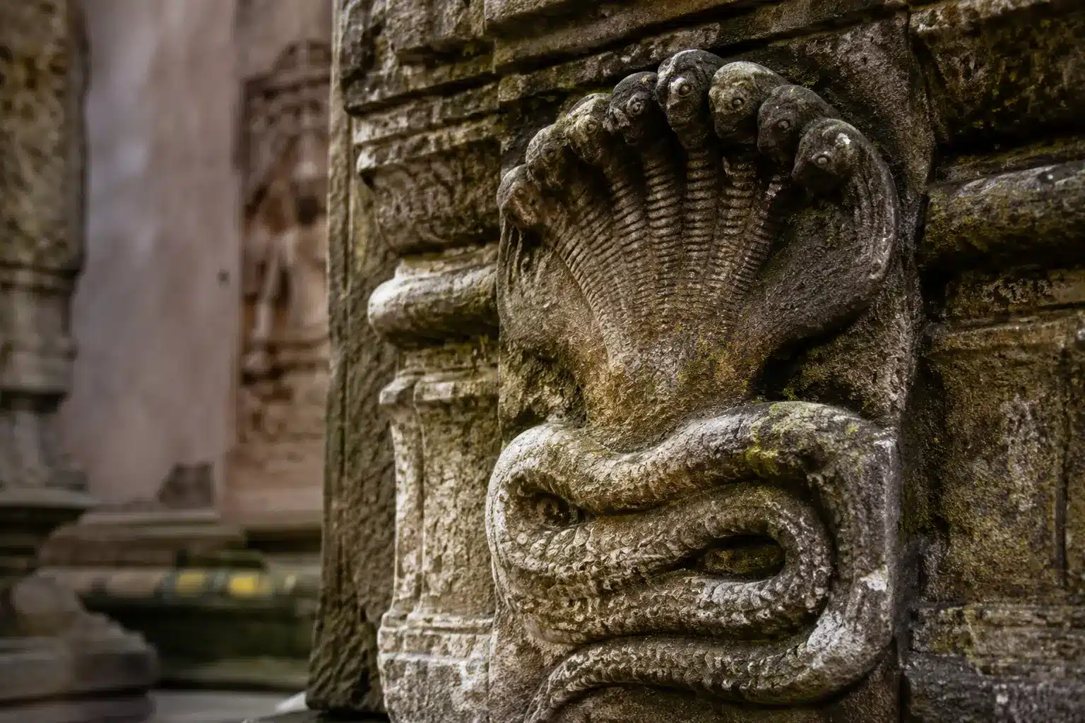 Ancient carved serpent deity relief linked to Naag Panchami mythology