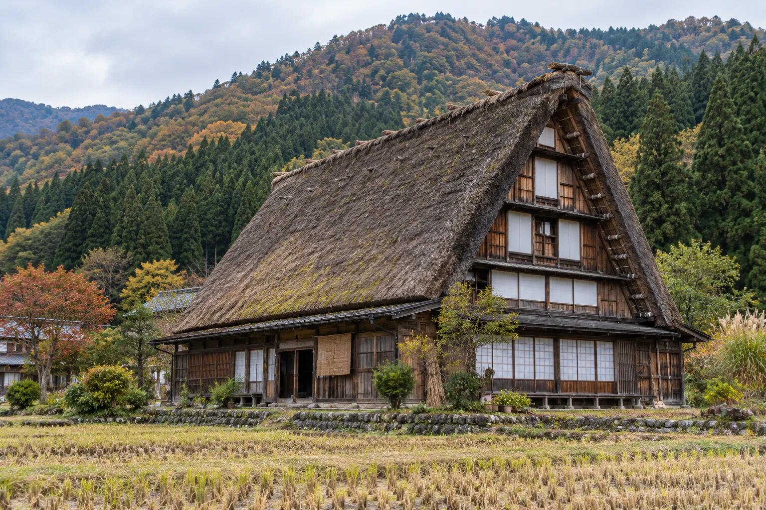 Gassho-zukuri farmhouse in Shirakawa-go with labels on its thatched roof and upper floors